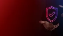 Ticked cybersecurity badge in businessman’s hand.