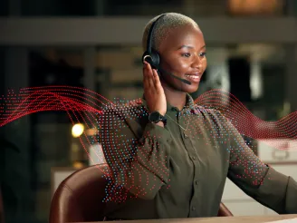 Helpdesk agent taking a phone call on her headset