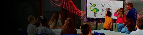 Group of children in classroom using a Sharp display