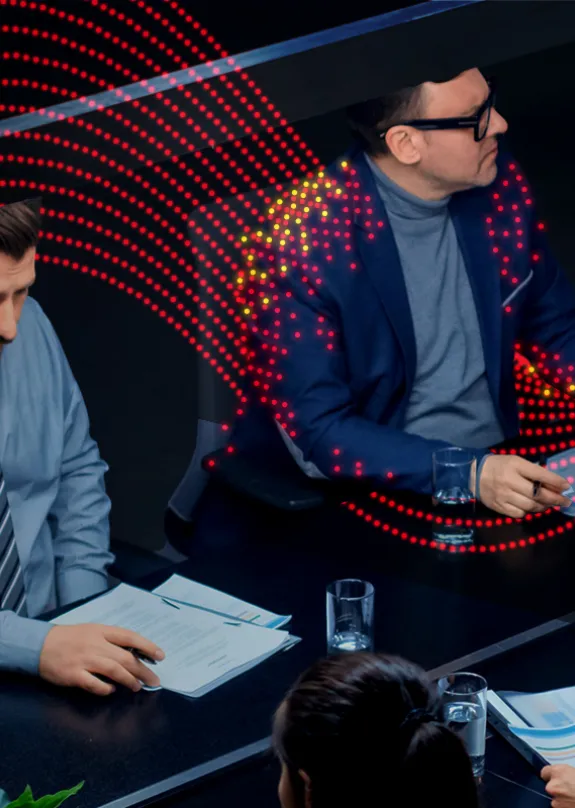 Boardroom meeting around a long table 